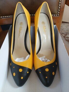 Sharp leather pumps done in yellow and black. New and unworn. Handmade in Europe